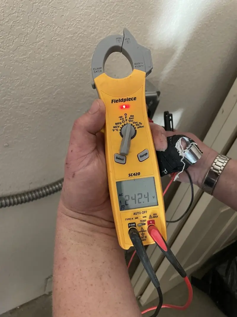 Voltage testing with clamp meter during Generator Installation in Ponce Inlet